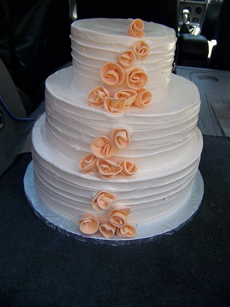 Free Form Coral Rolled Roses On Textured Buttercream Wedding Cake