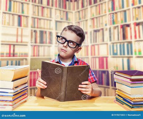 Schoolboy Reading Book In The School Library Stock Image Image Of