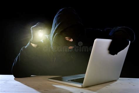 Expert Hacker With Computer Laptop Holding Flashlight Hacking System