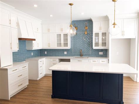 If your cabinets are finished in dark or medium wood. Blue-kitchen-islande-painted-in-Benjamin-Moore-Van-Deusen-Blue-blue-tiles-splashback-white ...