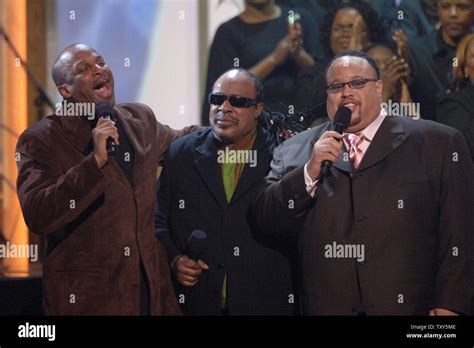 Donnie McClurkin (L-R), Stevie Wonder and Fred Hammond perform during