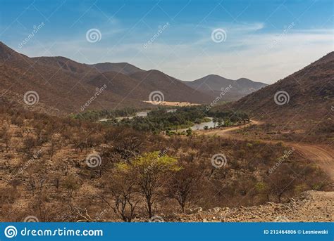 Landscape View Of The Kunene River The Border River Between Namibia