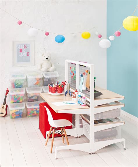 The kids do not have dressers, instead they have customized elfa closet systems and some drawers incorporated into the expedits for smaller clothing items. elfa Freestanding Kids Play Station with Birch Decor. An ...