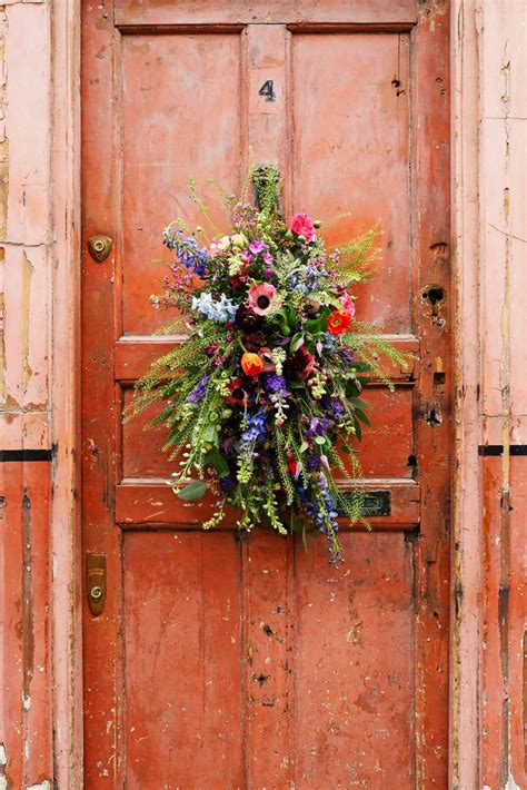 Old Door With A Delightful Floral Arrangement Photographer Catherine