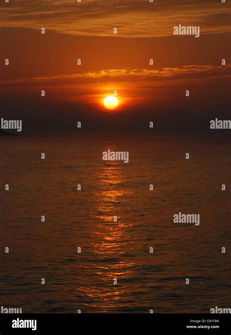 An Early Morning Sunrise Over A Lake Stock Photo Alamy