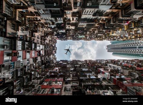 Hong Kong Transformers Building Looking Up With Plane Stock Photo Alamy
