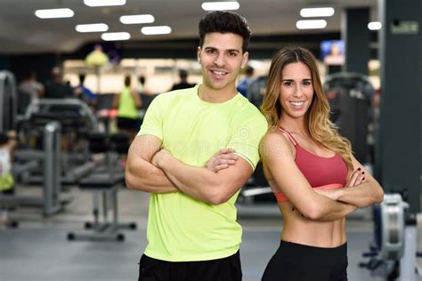 Man And Woman Personal Trainers In The Gym Stock Photo Image Of