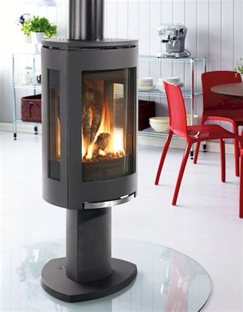 An outdoor wood burning stove heats up a water reservoir, then sends that water through underground hoses to your home. 60+ Scandinavian Fireplace Ideas Makeover for Your Living ...
