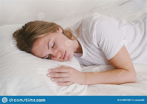 Young Beautiful Girl Sleeping In Bed On White Bedding Woman Close Up