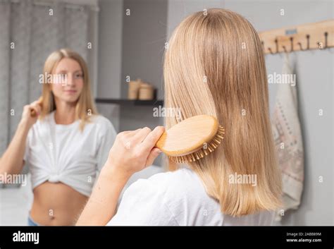 Beautiful Girl Combing Her Hair With Brush Blonde Woman Brushing Hair