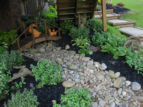 Mulch and rock are two of the most used in gardens today because of the incredible benefits they have. Painted Black Best Rubber Mulch | Landscaping with rocks ...