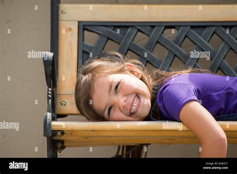 Little Girl Lying On Stomach High Resolution Stock Photography And