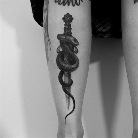 They associate this sign with grace, wisdom, organization, wisdom, wit, mystery. nice snake and sword tattoo on leg | Sword tattoo, Leg tattoos, Snake tattoo