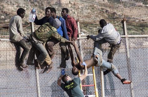 Hundreds Of African Migrants Break Through Border Fence To Enter Spain