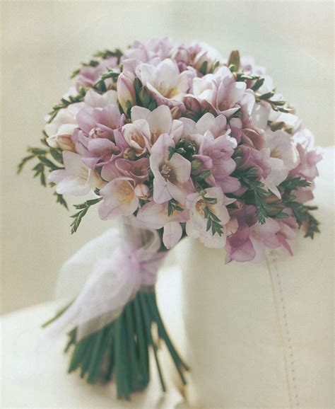 Bridal bouquet of ranunculus, freesias and roses. pink freesias | Freesia wedding bouquet, Alstroemeria ...