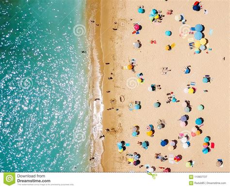 Aerial View From Flying Drone Of People Crowd Relaxing On Beach Stock