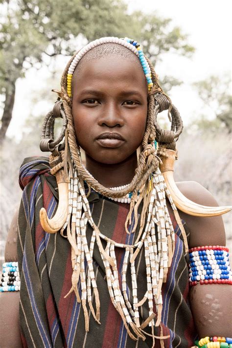 ethiopian mursi woman with intricate traditional jewelry