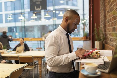 Businessman And Eating Lunch In Cafe Stock Image F0225278