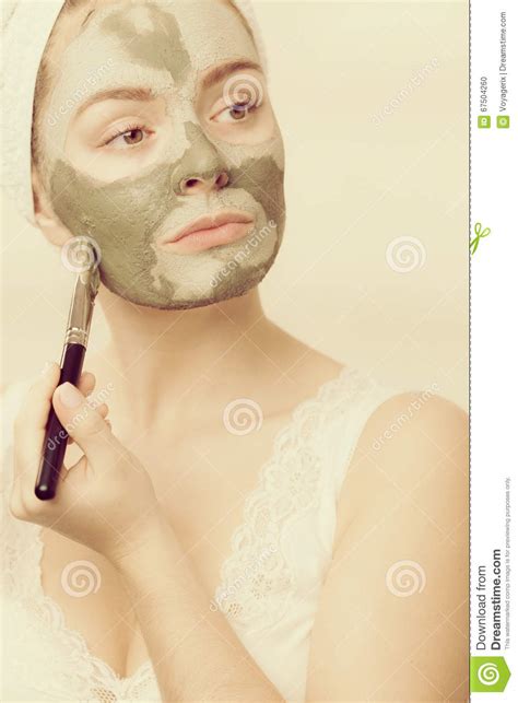 Woman Applying With Brush Clay Mud Mask To Her Face Stock Photo Image Of Mask Bathroom