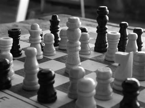 Grayscale Photograph Of Chess Pieces On A Chessboard · Free Stock Photo