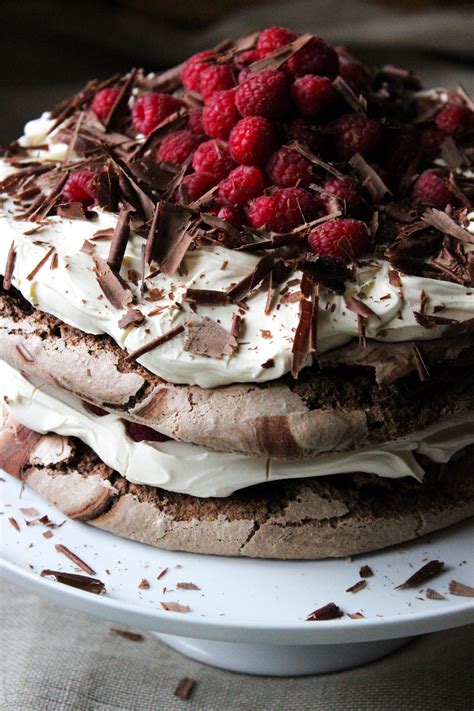 I would love to try a choc i forgot to add the grated chocolate to the meringue so added it to the whipped cream instead! chocolate meringue layer cake, meringue cake, chocolate cake, chocolate and raspberries, mothers ...