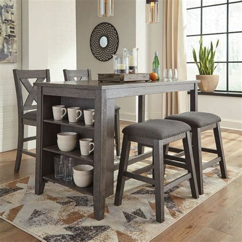 A counter set is an ideal dining set solution for taller individuals or simply those who wish to have a little more leg room while enjoying their meals. Signature Design By Ashley D388-113 Caitbrook Counter ...