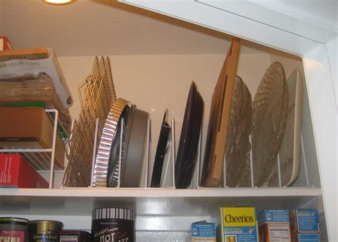 Search for kitchen cabinet dividers. A Jones For Organizing | Storing your cookie sheets ...