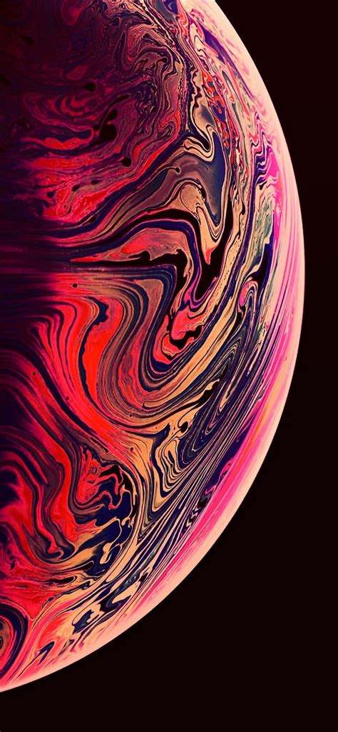 An Iphone With Colorful Swirls On The Front And Back Side Against A