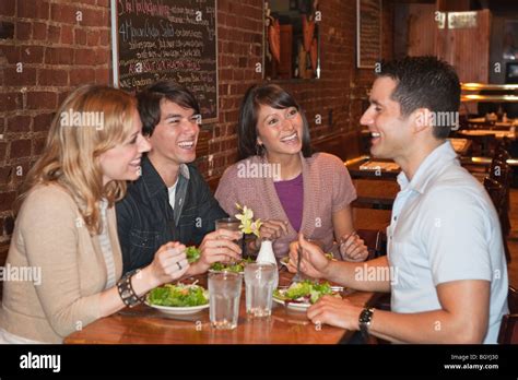 Friends Eating At Restaurant Stock Photo Alamy