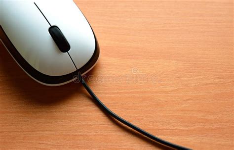 White Wired Computer Mouse On A Wooden Table Stock Photo Image Of