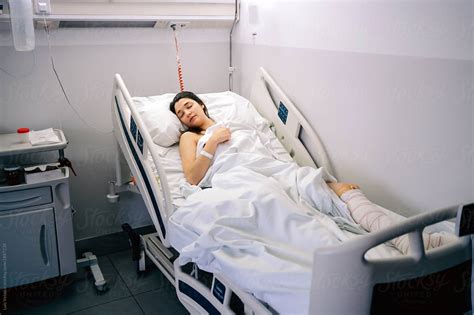Female Patient Sleeping In A Hospital By Stocksy Contributor Luis