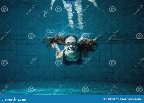 Athletic Swimmer Smiling At Camera Underwater Stock Image Image Of