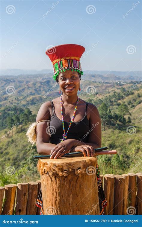 Portrait Of An African Zulu Woman In Traditional Dress Hat Smiling Lifestyle South Africa