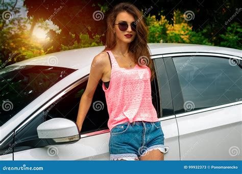 Beautiful Young Brunette Girl In Sunglasses Posing Outdoors With A Car Stock Image Image Of