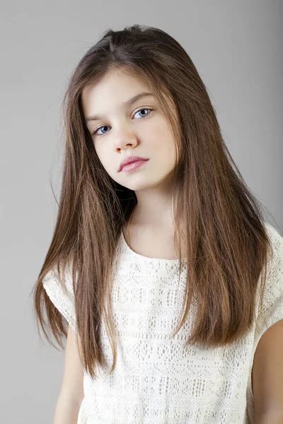 Portrait Of A Charming Brunette Little Girl ⬇ Stock Photo Image By