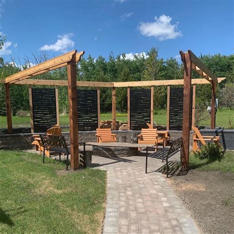 You can even keep a stockpile of wood underneath. Backyard Fire Pit | Fire pit backyard, Backyard design, Backyard