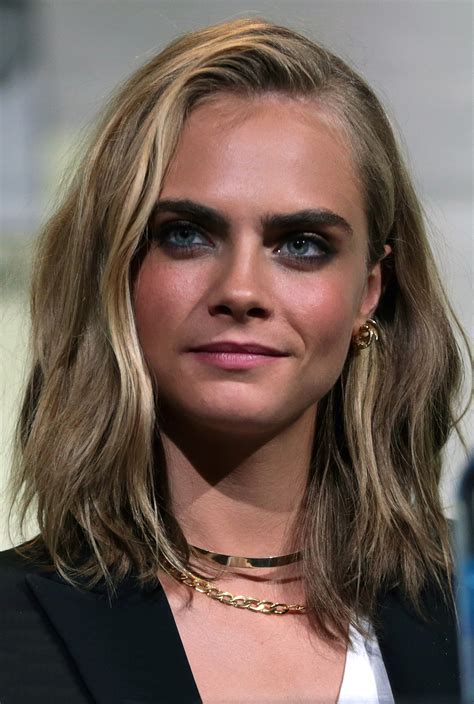 Well, more accurately, on her neck. Cara Delevingne - Wikipedia