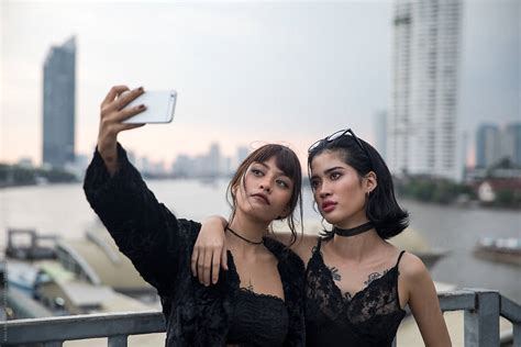 Two Asian Women Take A Selfie Together By Stocksy Contributor Jovo Jovanovic Stocksy