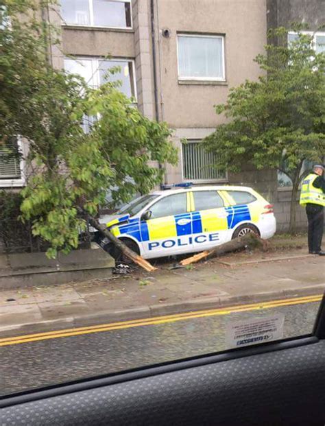 policeman taken to hospital after car hits mini and crashes through tree deadline news
