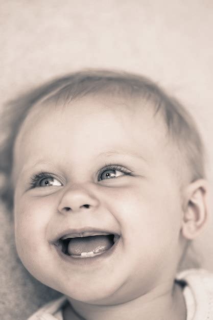 Premium Photo Smiling Baby Lying On Back