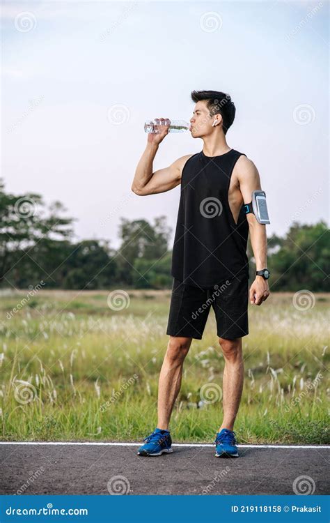 Men Stand To Drink Water After Exercise Stock Photo Image Of Relax