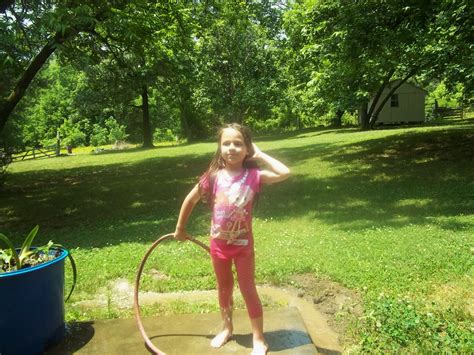 Waters In Tennessee Playing In The Mud And Getting Wet With The Sprinkler