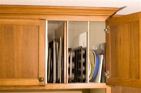 Cookie sheet dividers above the refrigerator Custom Cabinetry, Dividers