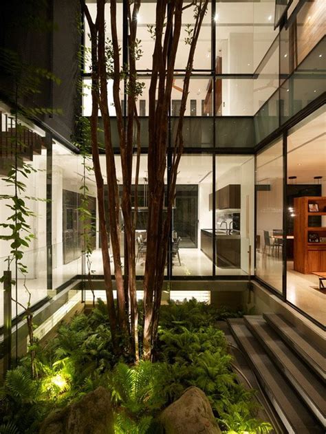 A small yet refreshing indoor courtyard with moss, rocks and several trees growing here. Indoor garden. | Interior garden, Indoor courtyard, Garden ...