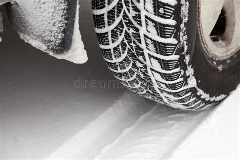Close Up Of Car Tyre In Winter Covered With Snow Winter Tyre In