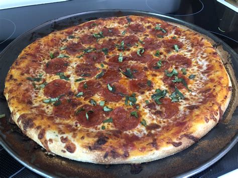 Pepperoni Pizza With Fresh Basil On Garlic And Italian Herb Crust R