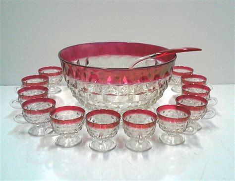 Maybe you would like to learn more about one of these? Vintage Cranberry Glass Punch Bowl Set of 14 - 1970s