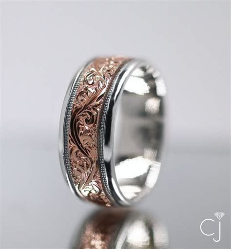 We offer five times the selection of ordinary jewelry stores, price it well, and present it with the help of a team of experts, thereby creating the ultimate jewelry shopping experience. Rose Gold Scrollwork on Men's Wedding Band | Mens wedding bands, Wedding rings, Custom ...
