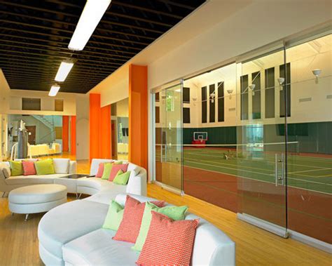 It is a firm rectangular surface with a low net stretched across the centre. Indoor Tennis Court | Houzz