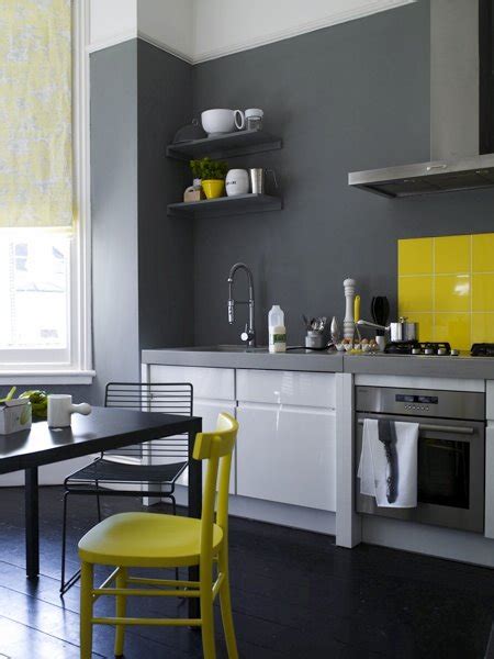 An accent wall is your chance to express your style with a bold color. polly wreford dark grey kitchen yellow accents chair ...